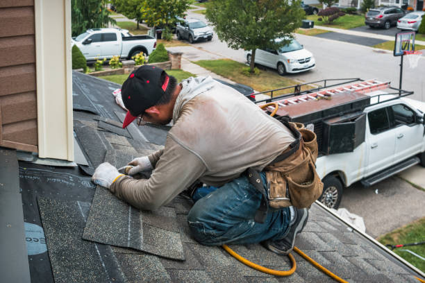 Professional Roof Replacement technician working in Brookfield, MA